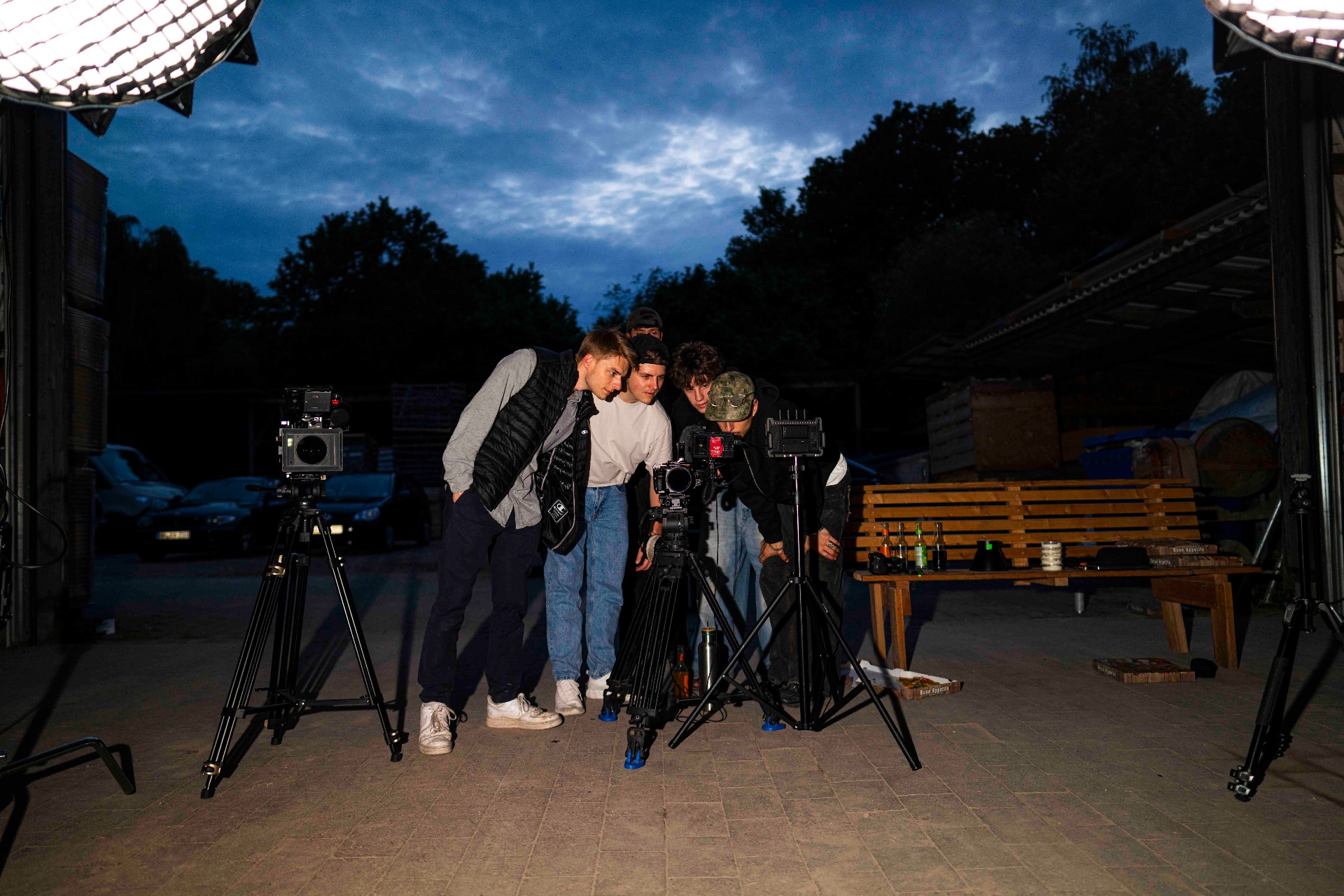 The team huddled around the camera, checking playback