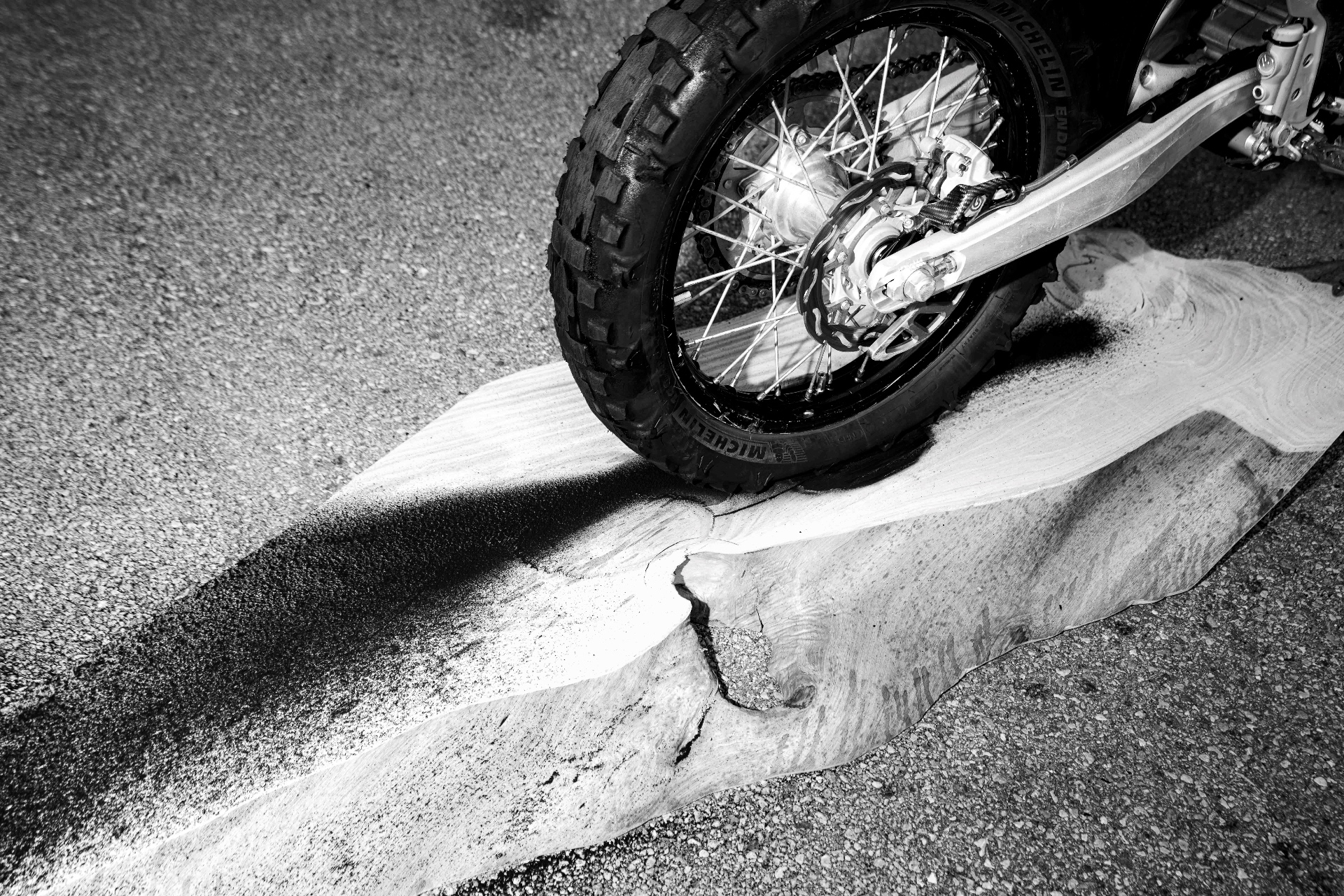 Tire resting on the burned wooden plank