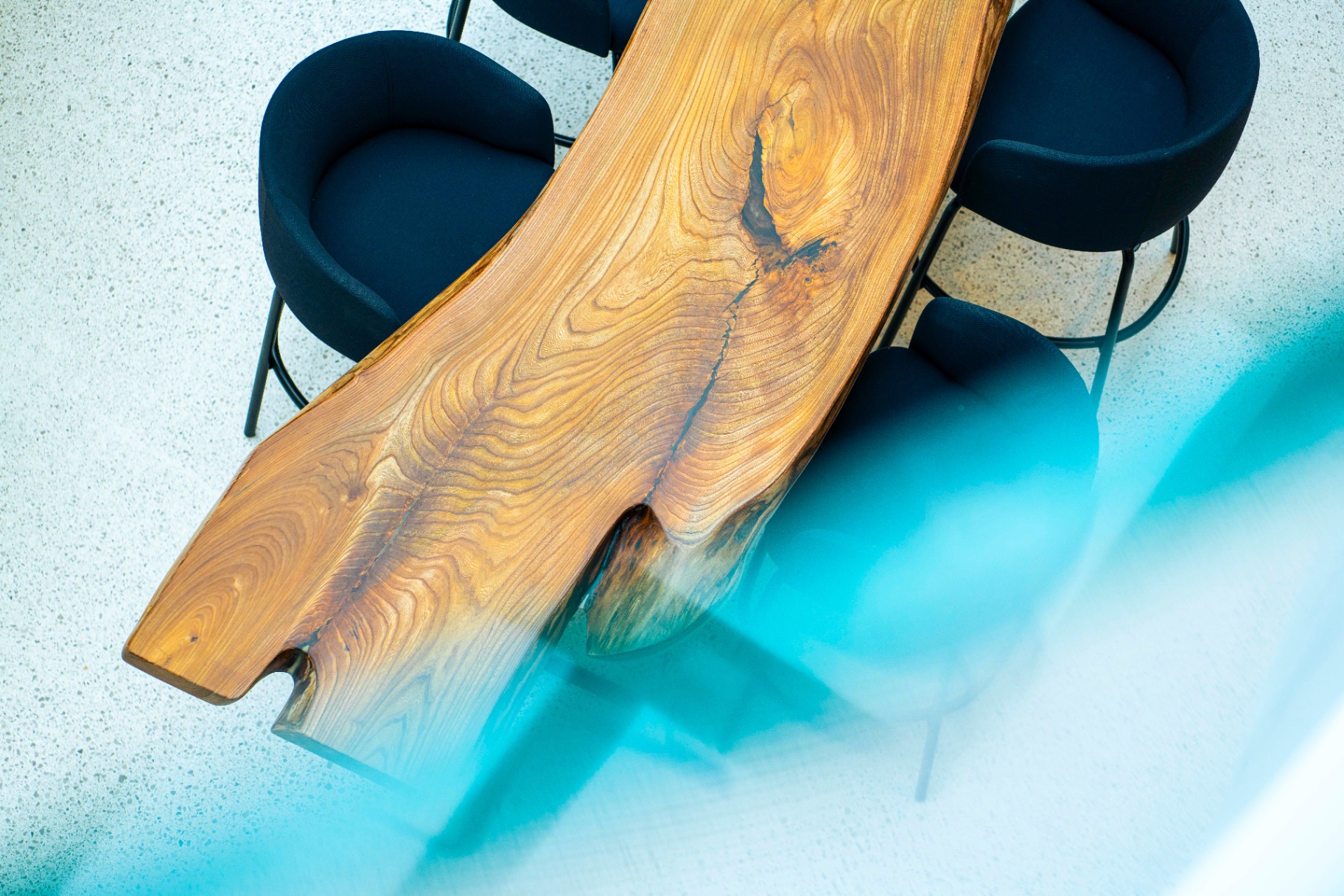 Top-down detail of the live-edge wooden slab